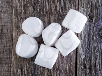 white marshmallows  on the wooden table, fresh and sweet marshmallows