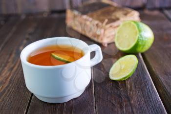 fresh tea with lemon in white cup