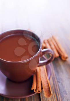 cocoa drink with cinnamon on a table