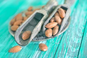 almond in spoon and on a table