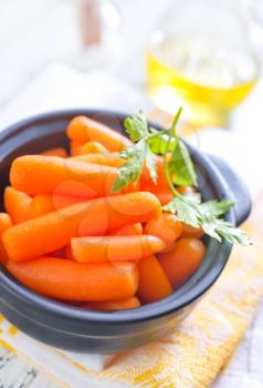 carrots in bowl and on a table