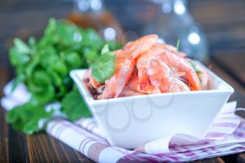 shrimps in bowl and on a table