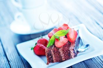 chocolate cake with strawberry on plate