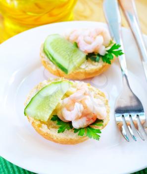 avocado with shrimps on the white plate