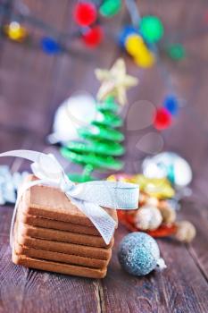 christmas cookies and decoration on the wooden table