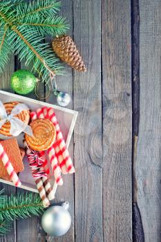 christmas background, christmas cookies and decoration on wooden boards
