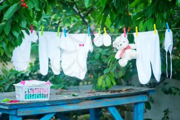 baby clothes in garden, clear baby clothes