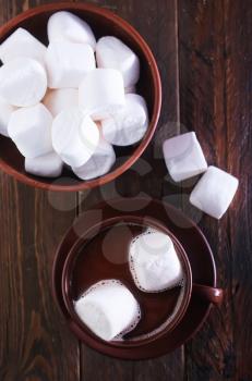  cocoa drink with marshmellow on the wooden table