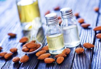 almond oil in bottle and on a table