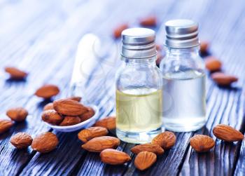almond oil in bottle and on a table