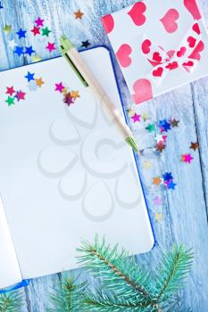 notebook and christmas decoration, notebook on a table