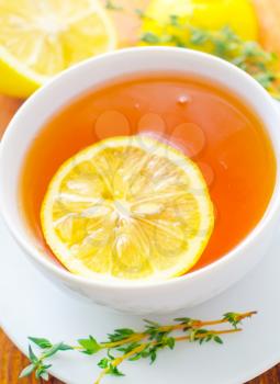 Fresh tea with lemon in the white cup