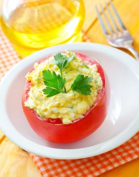 Baked tomato with boiled eggs and cheese