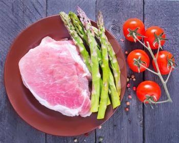 raw meat and asparagus
