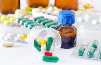 color pills and medical bottle