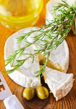Italian cheese with olives and rosemary