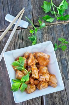 fried meat in bowl and on a table