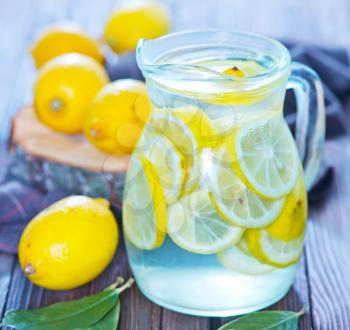 fresh lemonad in the jug and on a table