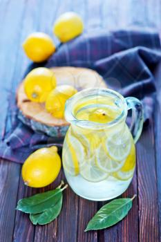 fresh lemonad in the jug and on a table