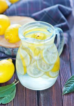 fresh lemonad in the jug and on a table