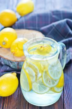 fresh lemonad in the jug and on a table