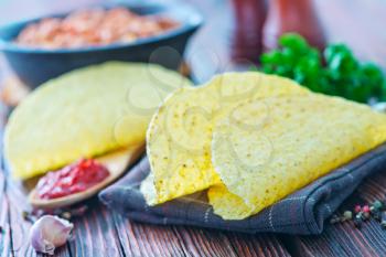 Tacos - in mexican yellow corn tortilla , empty tortilla