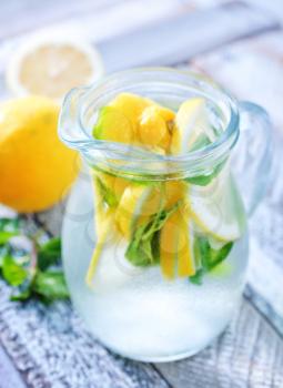 fresh lemonad in glass and on a table