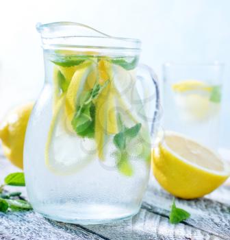 fresh lemonad in glass and on a table