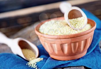 cous-cous in bowl and on a table