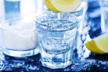 tequilla with salt and lime on a table