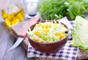 salad with corn in bowl and on a table