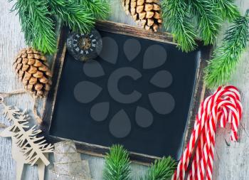 black board and candy canes on a table