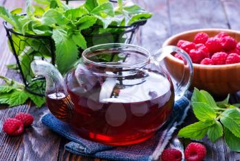 raspberry tea and fresh berries on a table
