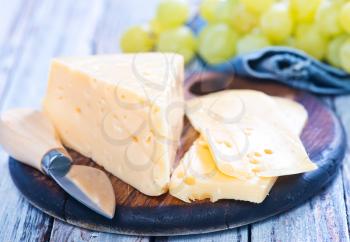 cheese with grape on the wooden table