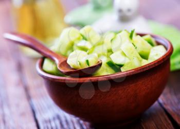 salad from cucumbers in the brown bowl