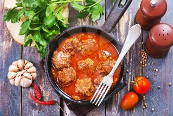 meat balls with sauce in the pan