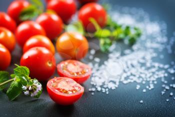 raw tomato cherry on the black table