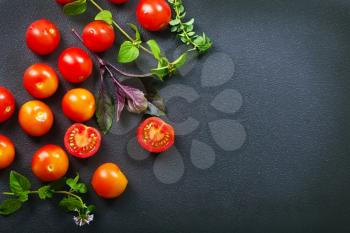 raw tomato cherry on the black table