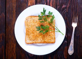 fried tost on plate and on a table