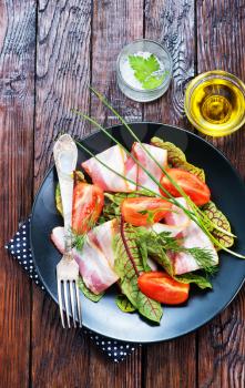 fresh salad on plate and on a table