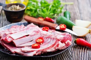 raw meat with salt and spice, raw meat on a table