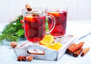 christmas drink with fruits and aroma spice