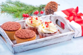 muffins and christmas decoration on a table