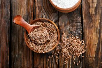 flax seed and flour on the wooden table