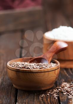 flax seed and flour on the wooden table