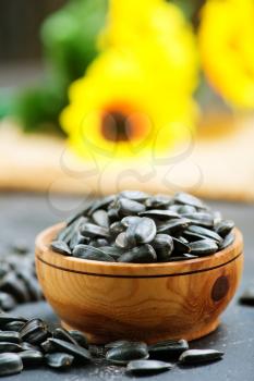 sunflower seed in bowl and on a table