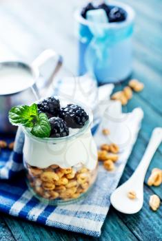 breakfast on a table, yogurt with flakes and berries