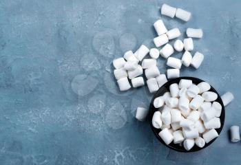 marshmallow in bowl and on a table