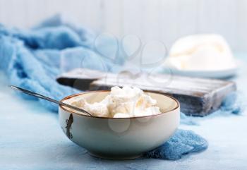 ricotta in bowl and on a table