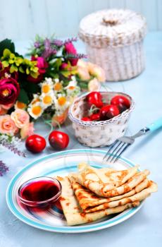 pancakes on plate and on a table